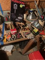 Table overview showing Foredom box, chisels, tape, brushes