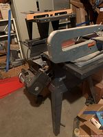 Craftsman 10-inch scroll saw showing motor and frame details.