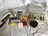 Overall fishing kit display showing all kit components: knife, fishing line, soft baits, lures, tackle box, and fly fishing reel