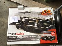 Box of Think Swiss 3-in-1 hot stone, grill and raclette electric appliance with 1200W power.