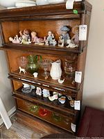 Front view of four-section barrister bookcase showing overall condition and style
