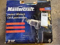 Top side of the original cardboard box showing brand and product specifications such as 7.5 amps, 1/2 inch drive, 2100 RPM single speed, 240 ft-lb torque, die-cast aluminum housing.