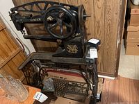 Front view of Singer sewing machine on treadle stand