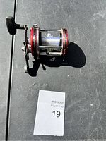 Top view of the Abu Garcia fishing reel showing the handle, frame, and line spool.