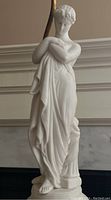 Front full view of white porcelain female figure standing on base
