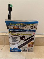 Photo of the Dryer Lint Removal Kit packaging showing the product and its components