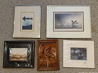 Five framed nature-themed art pieces arranged on carpet, showing varied frame styles and sizes.