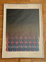 Full frontal image of lithograph framed under glass showing geometric colorful design with mat and frame.