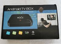 Box top showing the MX III Android TV Box, Quad Core CPU, 4K UHD, KODI, and multimedia gateway branding.
