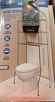 Photo showing the bathroom space saver organizer over a toilet and the color changing shower head packaged on top.