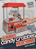 Front view of the boxed Jumbo Candy Grabber Machine showing the claw, coin slot, and candy dispenser.