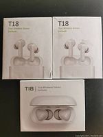 Front view of the three T18 True Wireless Stereo Earbuds boxes showing earbuds and charging cases on packaging.