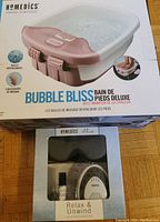 Homedics Bubble Bliss Deluxe Foot Spa Bath box with bubble massage and 3 accessories.
