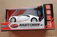 Front-side view of the box showing the white Bugatti Chiron RC car, branding, and product details.