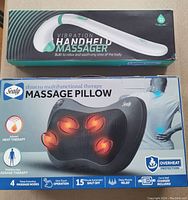 Photo showing both items in packaging: vibration handheld massager and Sealy massage pillow.
