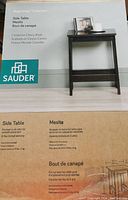 Front of the Sauder Beginnings Collection side table packaging showing product image, brand and finish information.