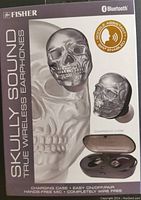 Front of the retail box showing Fisher branding, Bluetooth logo, and large skull earbud image with charging case.