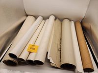 Image showing 8 posters rolled up in tubes or loosely rolled.