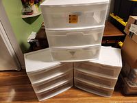 All three Sterilite 3-drawer plastic storage containers stacked and side-by-side, showing overall exterior condition and drawer visibility.