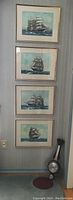 Four framed and matted nautical prints vertically aligned on a wall, depicting sailing ships by Hugh Knollys.