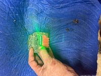 Bosch battery LED charge indicator lit showing battery is charged.