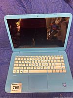 Front view of light blue HP Stream laptop with keyboard and screen visible, showing condition and details