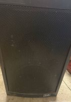 Front view of Liberty 4500 speaker showing black metal grille and plastic enclosure.