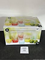 12 piece acrylic drinkware set in original packaging showing colorful textured glasses, including 6 highball and 6 lowball glasses.