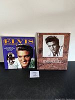 Front cover of two Elvis Presley books showing 'The Elvis Encyclopedia' and 'The Films of Elvis Presley'