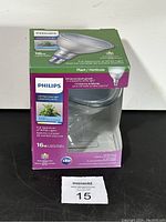 Front view of Philips LED Plant Grow Light bulb box showing product branding, wattage (16W), and key features such as full spectrum white light for optimized plant growth.