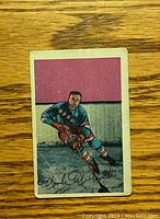 Front side of vintage 1952-53 Parkhurst Nick Mickoski hockey card showing the player in uniform on the ice.