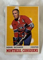 Front of the 1970-71 O-Pee-Chee Henri Richard Montreal Canadiens hockey card showing the player in red uniform with yellow background.