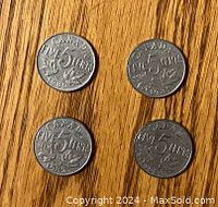 Reverse side of the four Canadian 5 cent nickels dated 1930, 1931, 1932, 1933 with denomination and maple leaves.