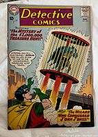 Front cover of Detective Comics #313 featuring Batman grappling with a flying jail-cell, colorful and in good visible condition.