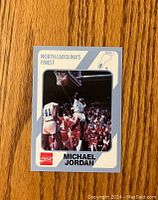 Front photo of the Michael Jordan North Carolina basketball card showing Jordan in action.