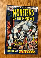 Front cover of Monsters On The Prowl #14 comic book showing the giant white monster attacking a city with title and price details.