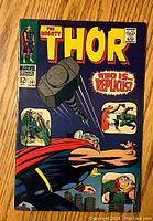 Front cover of The Mighty Thor comic book issue #141 with comic title, date Jan, price 12 cents, featuring Thor and question 'Who is... Replius?'