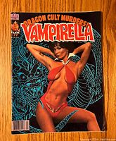 Front cover of Vampirella Magazine issue #77 featuring a woman in red posing against a dragon background with the title 'Dragon Cult Murders'.