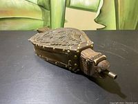 Fireplace bellows showing full length and leather embossed body with brass rivets.