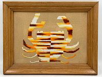 Photo of vintage framed embroidered crab artwork showing craft and frame.