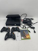 Duplicate image providing additional view of all items in the lot including console, controllers, Kinect sensor, cables, game and manual.