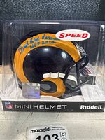 Mini helmet side view showing Dick Vermeil signature with HOF 2022 inscription and JSA authentication sticker.