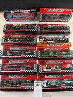 Top view of 10 Matchbox Team Convoy NASCAR toy car sets in original packaging showing various teams and numbers.