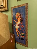 Full view of the artwork showing a cartoonish girl dancing on a blue background printed or painted on a textured wood panel with a carved border.