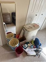 Full view of the lot containing mirror, waste bins, hamper, small containers and headrests