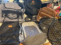 Overall lot showing 5 bags including Adidas, Crown Royal and brown leather look bag.