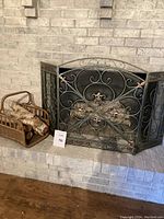 Fire screen and log holder together on fireplace hearth with label Lot 50