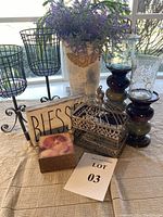 Photo of the whole set displaying the candle holders, metal vase with faux flowers, wooden Blessed sign, birdcage-style metal box, and wooden boxes.
