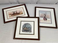 Three framed goose prints arranged together showing their frames and matting.