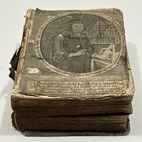 Front cover view showing engraved portrait and condition wear.